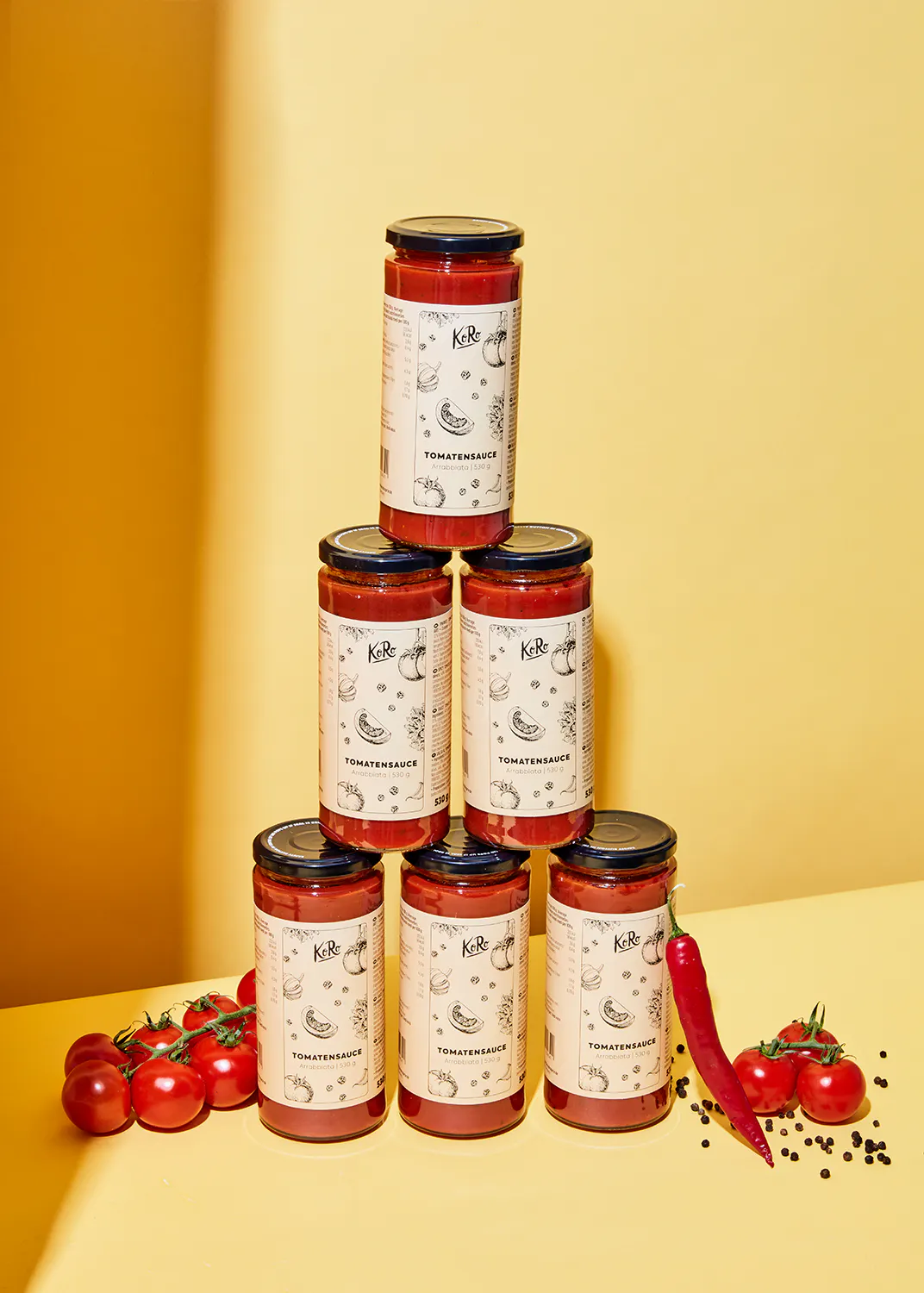 six jars of kirb tomato sauce stacked on top of each other