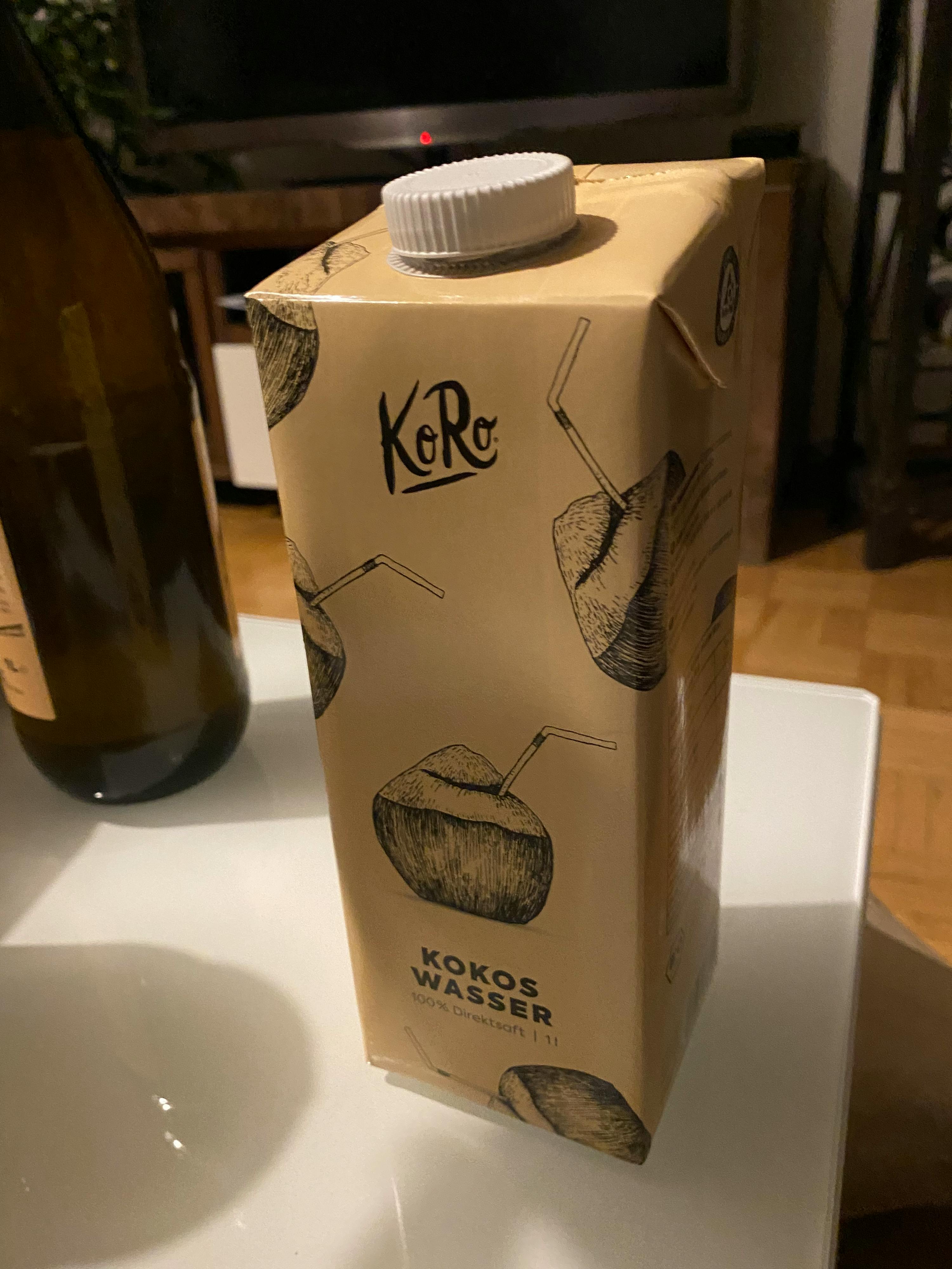 a carton of coconut water sits on a counter