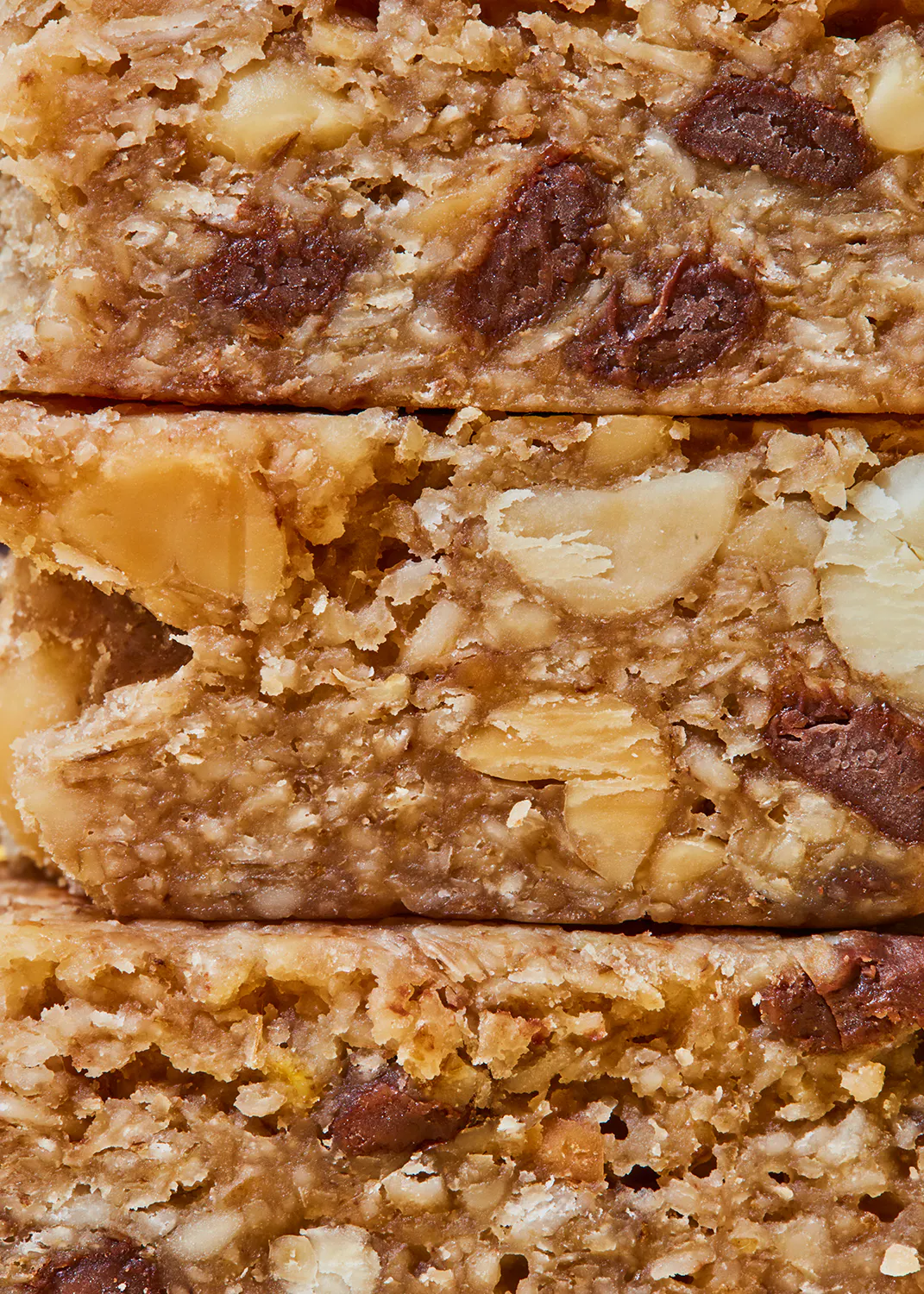 a stack of oatmeal bars with chocolate chips and almonds