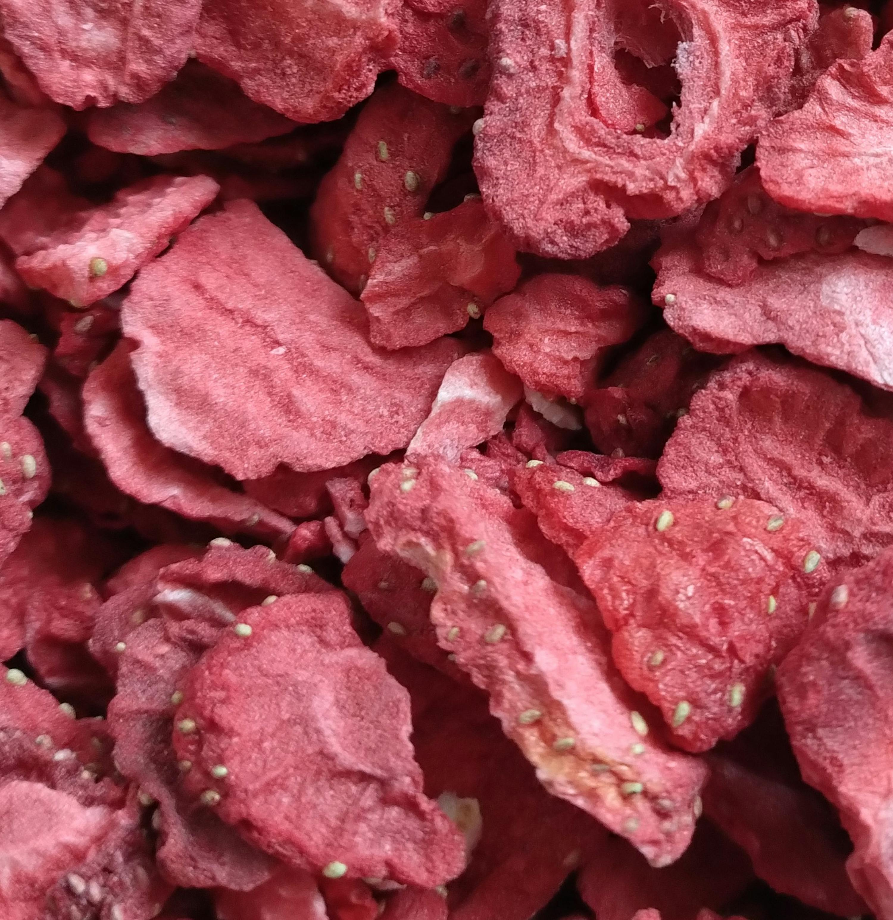 a close up of a pile of dried strawberries