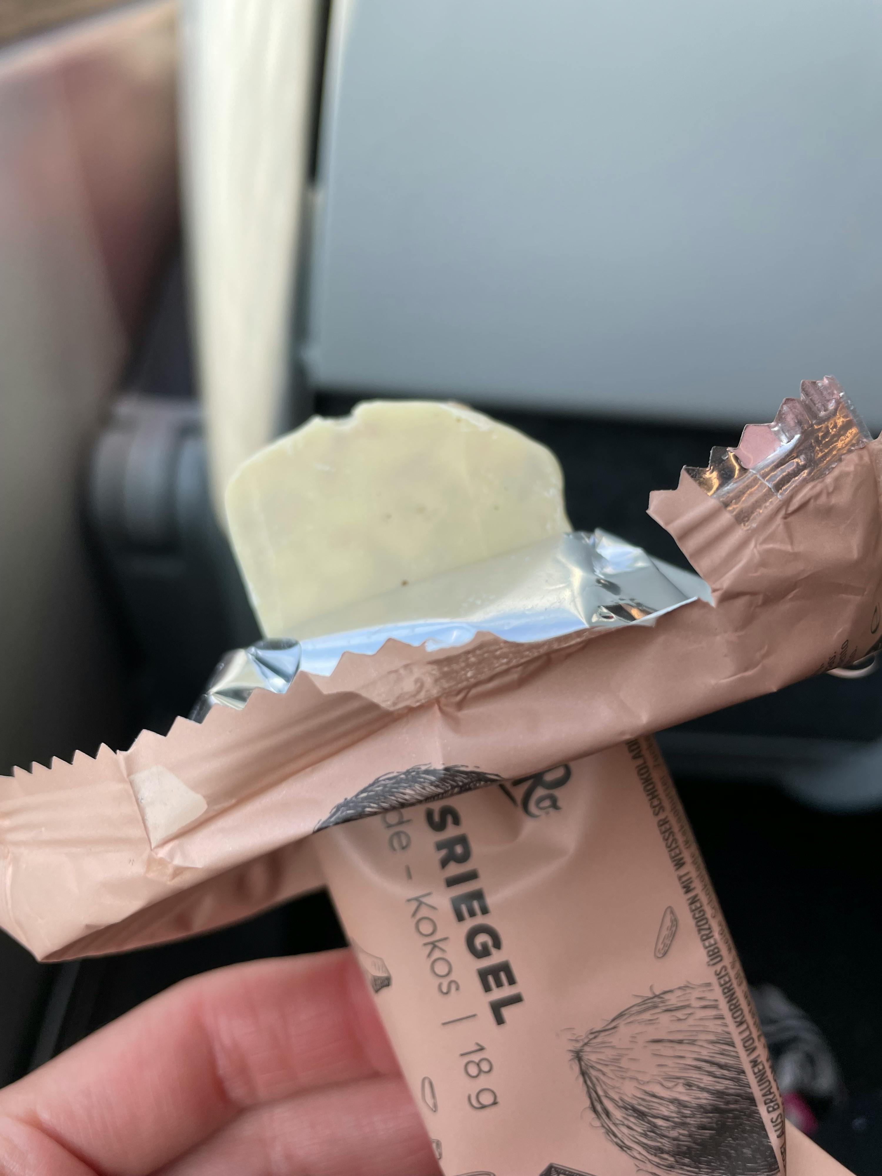 a person is holding a bar of siegel de kokos