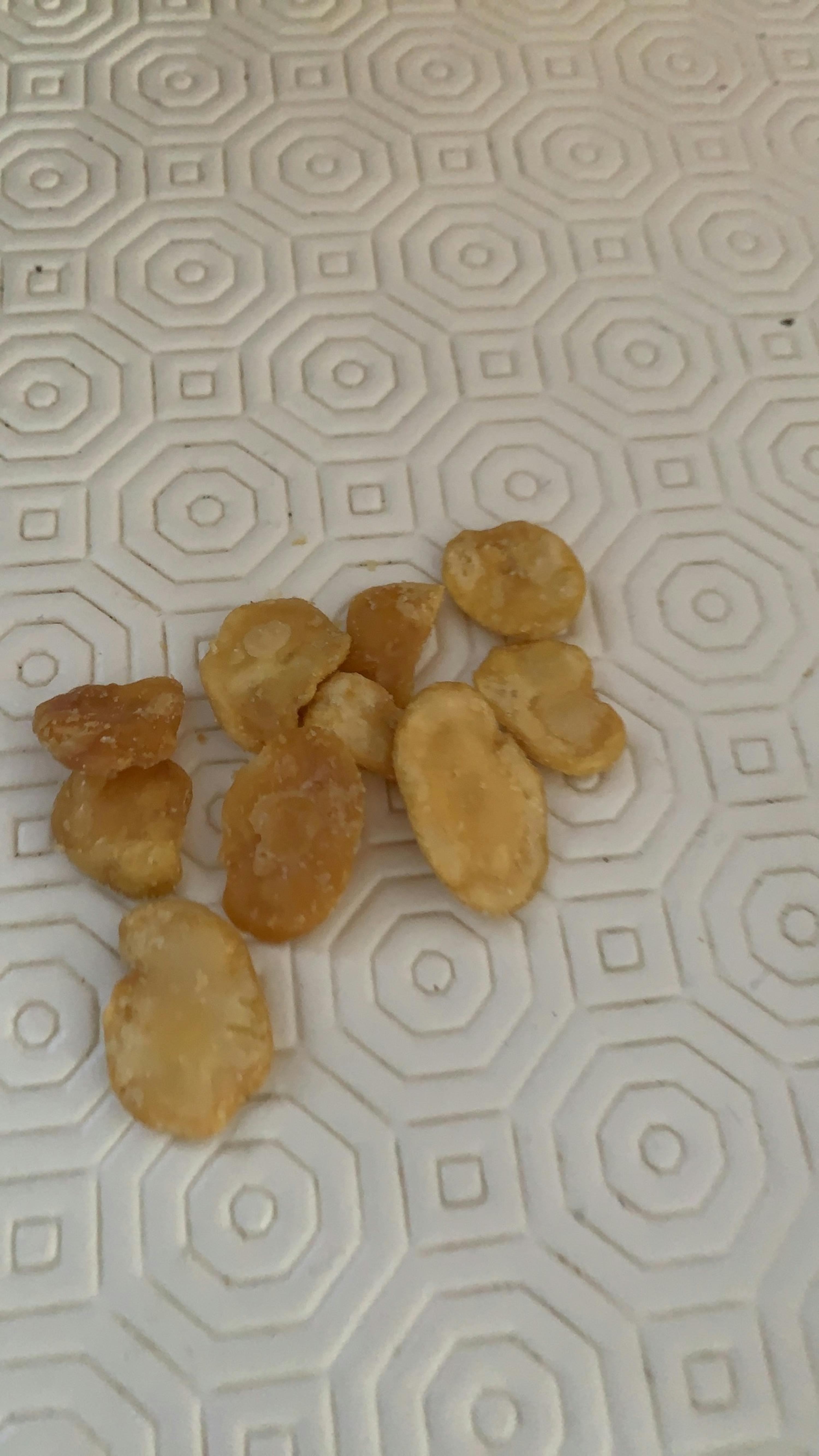a few pieces of fried food on a white surface