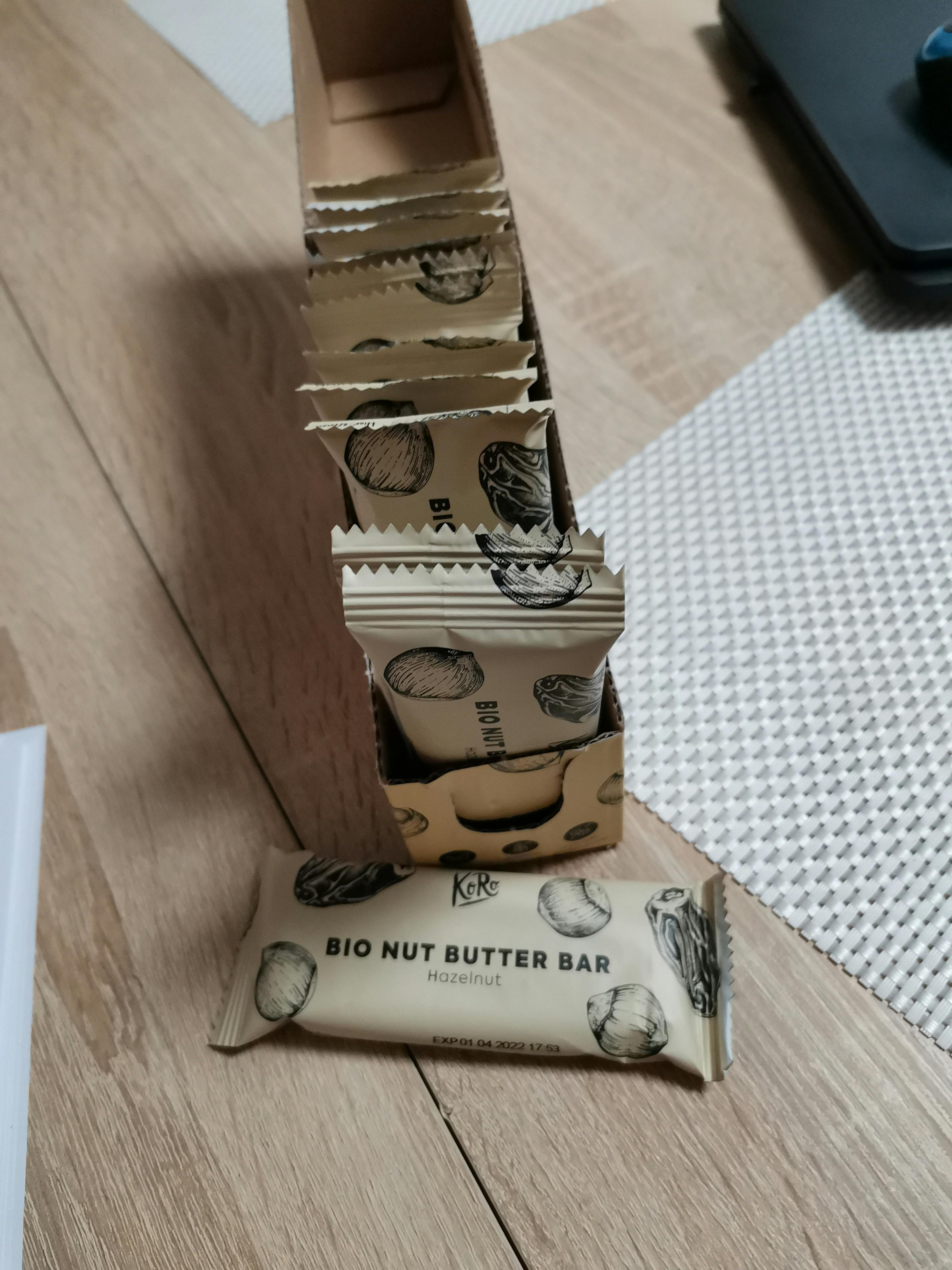 a box of bio nut butter bars on a wooden table