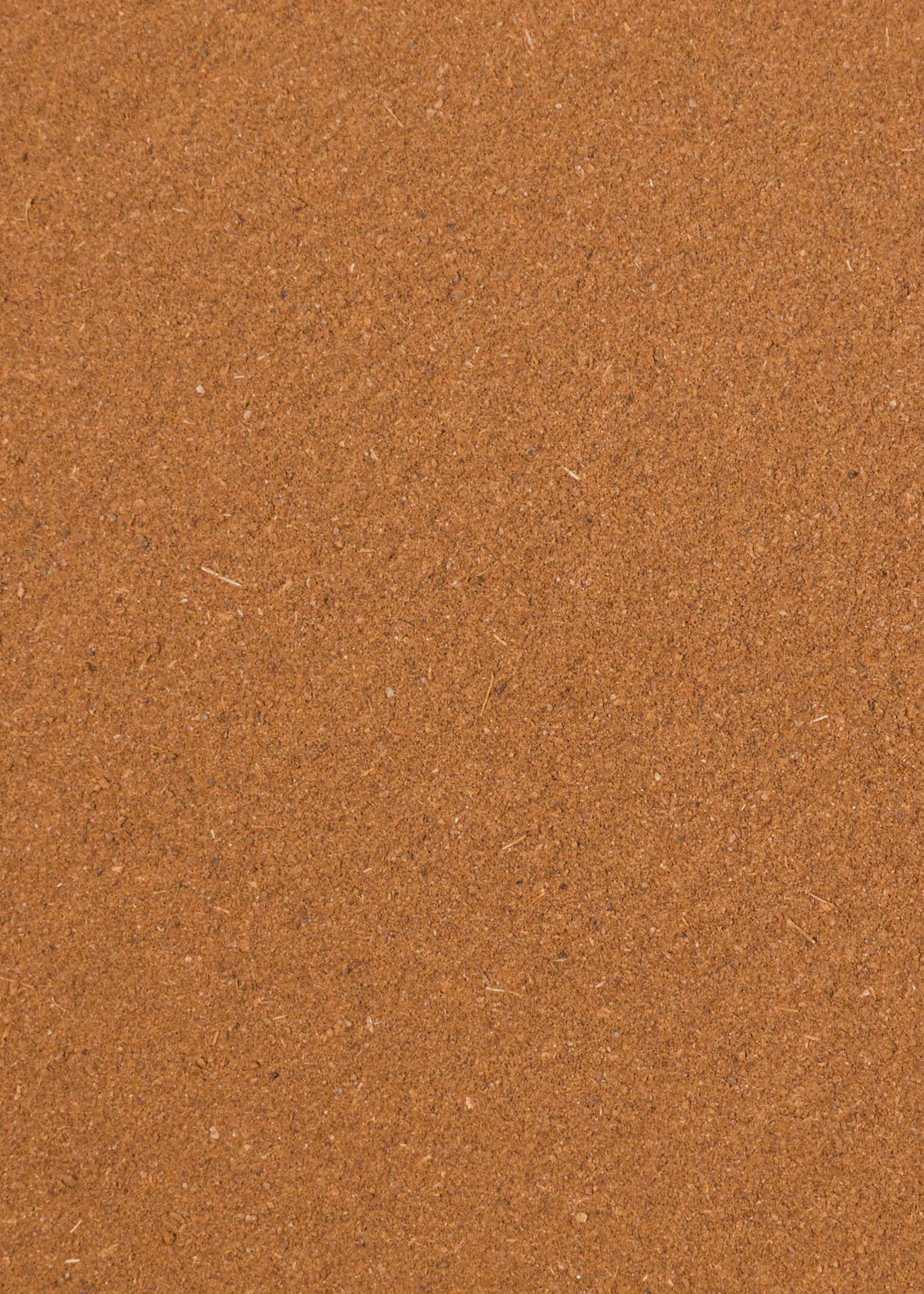 texture granuleuse brun-rougeâtre avec de petites particules et fibres claires.