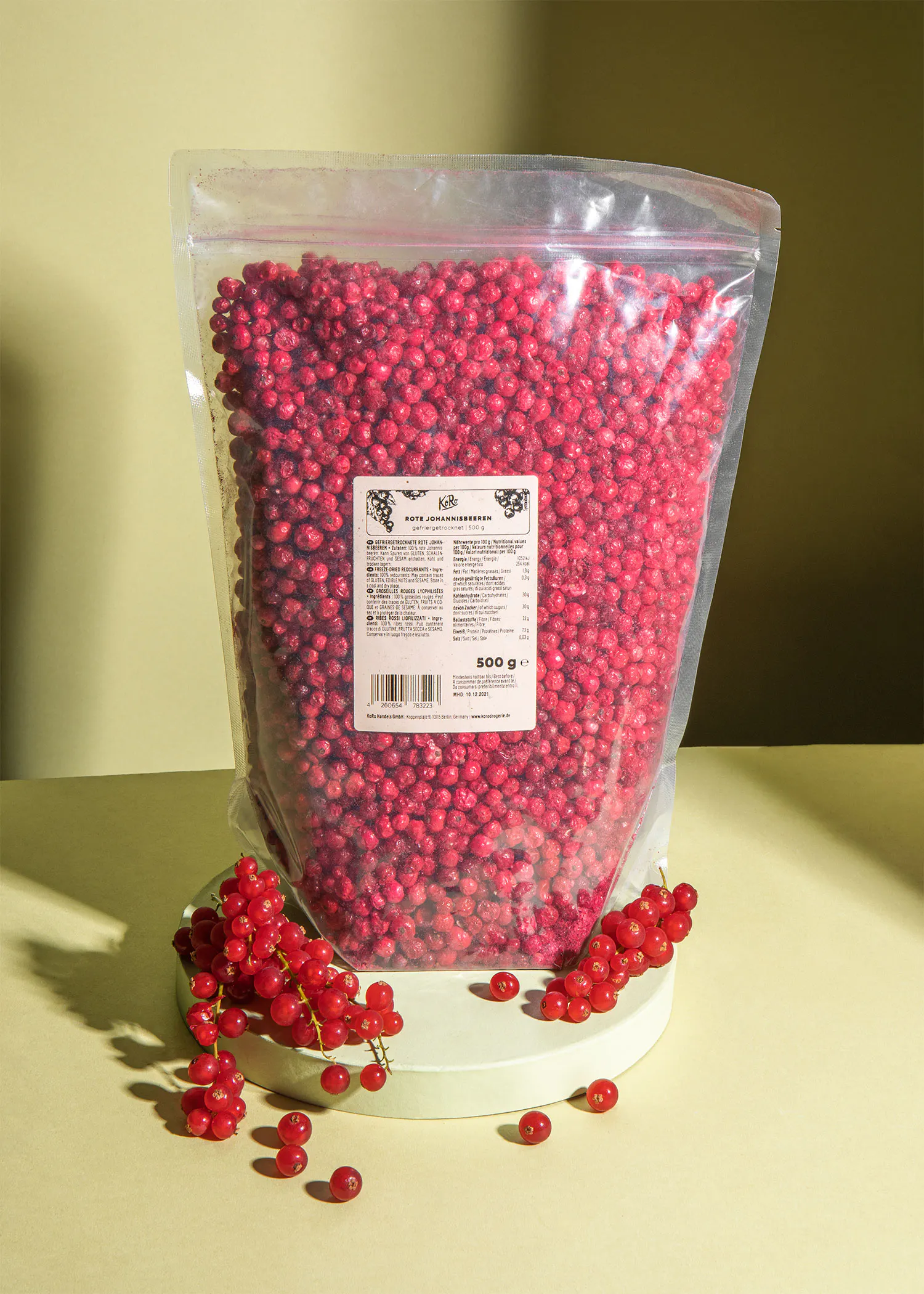 a bag of red currants is sitting on a table