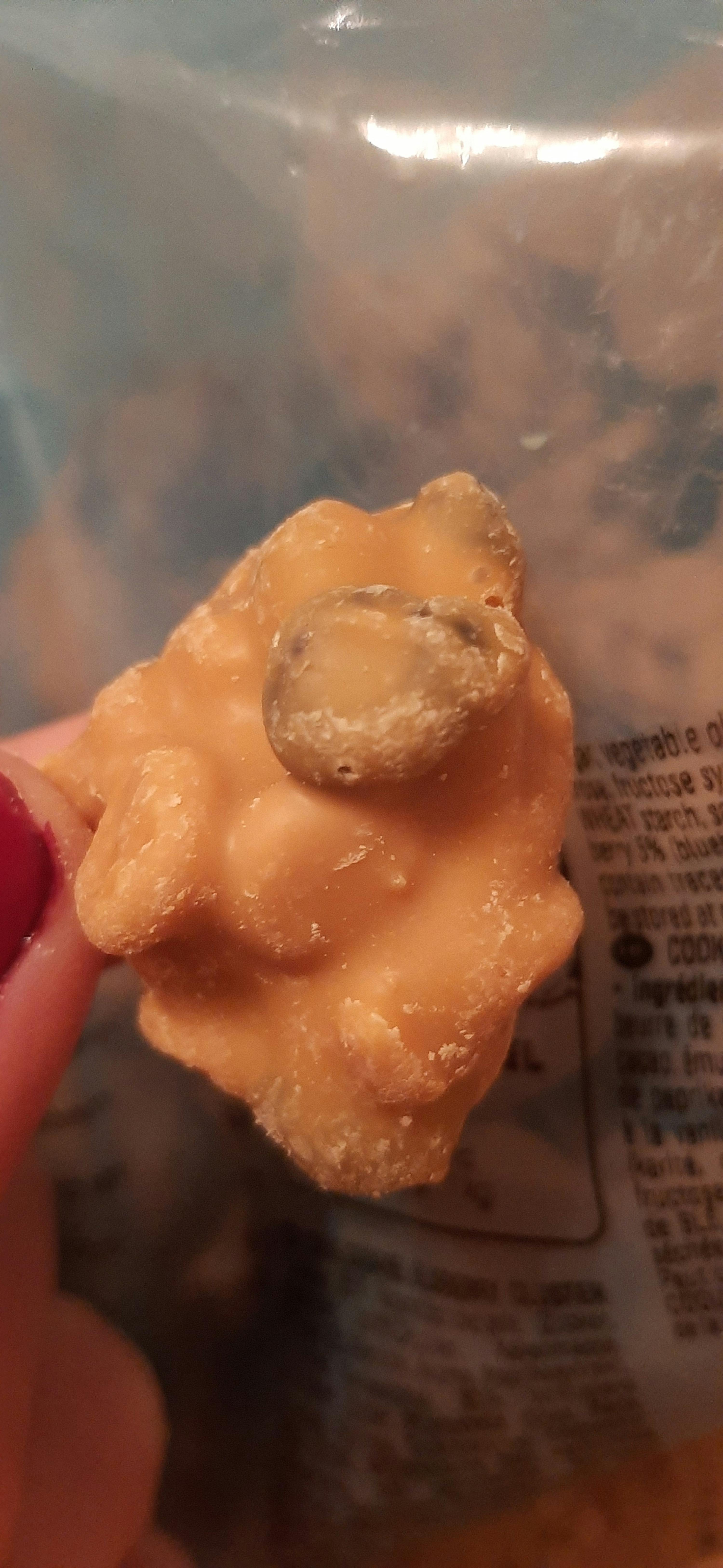 a person is holding a piece of food in their hand