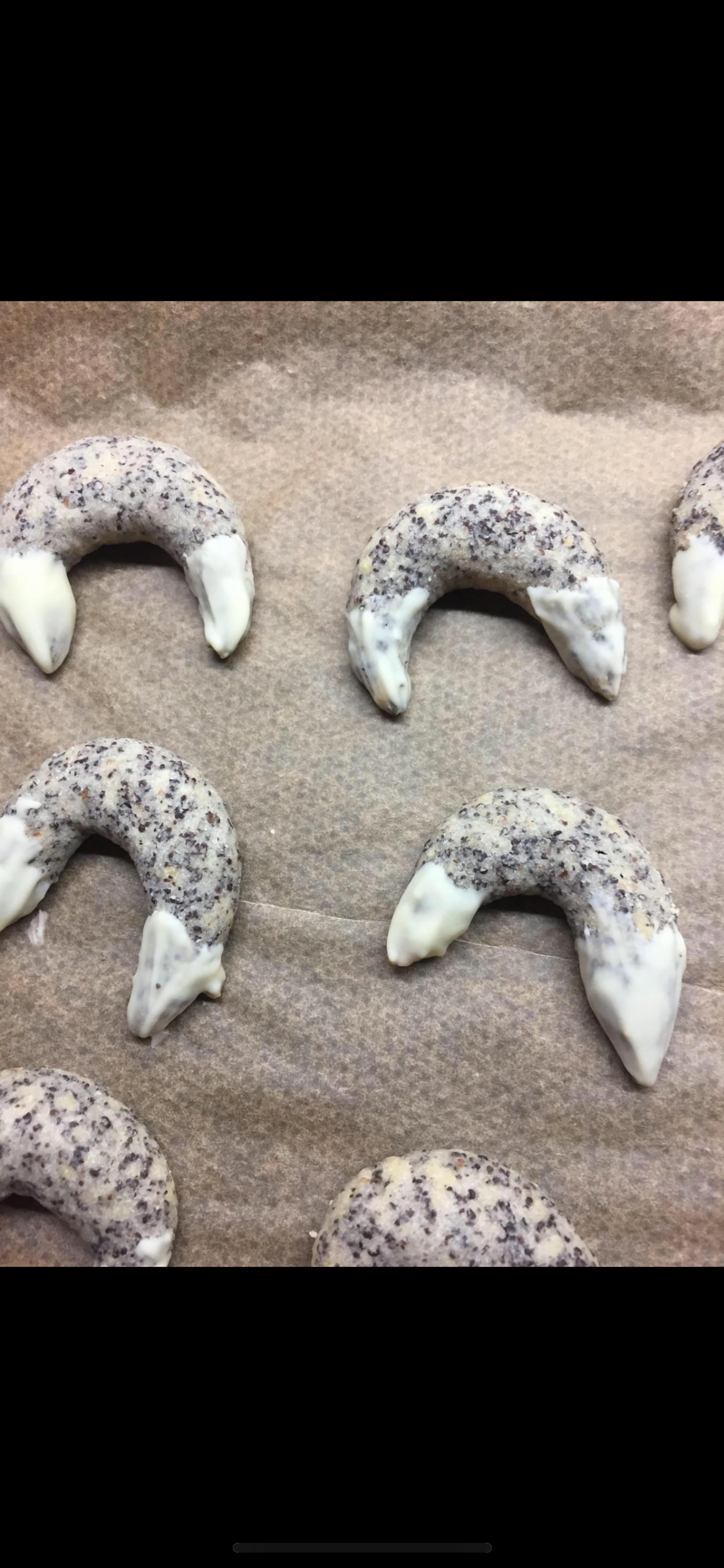 a bunch of cookies are sitting on a piece of wax paper