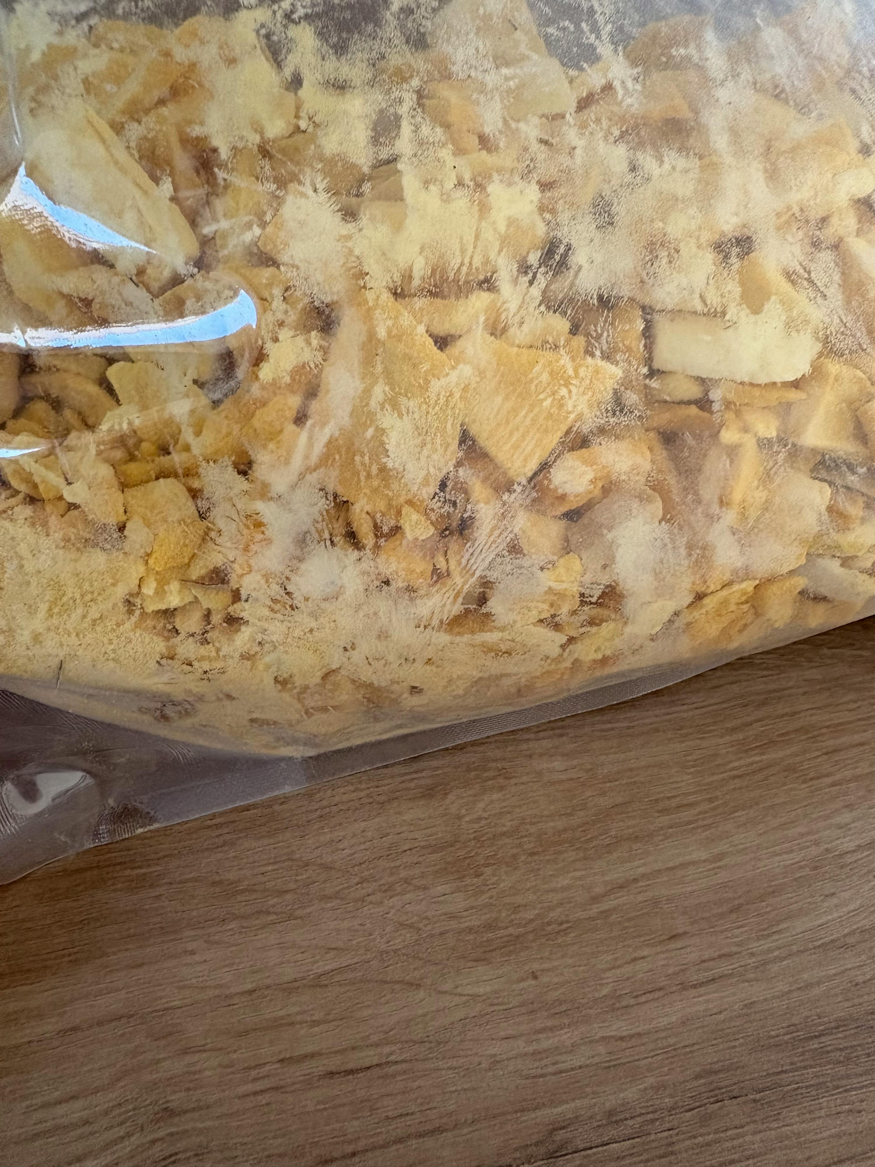 a bag of food sitting on a wooden table