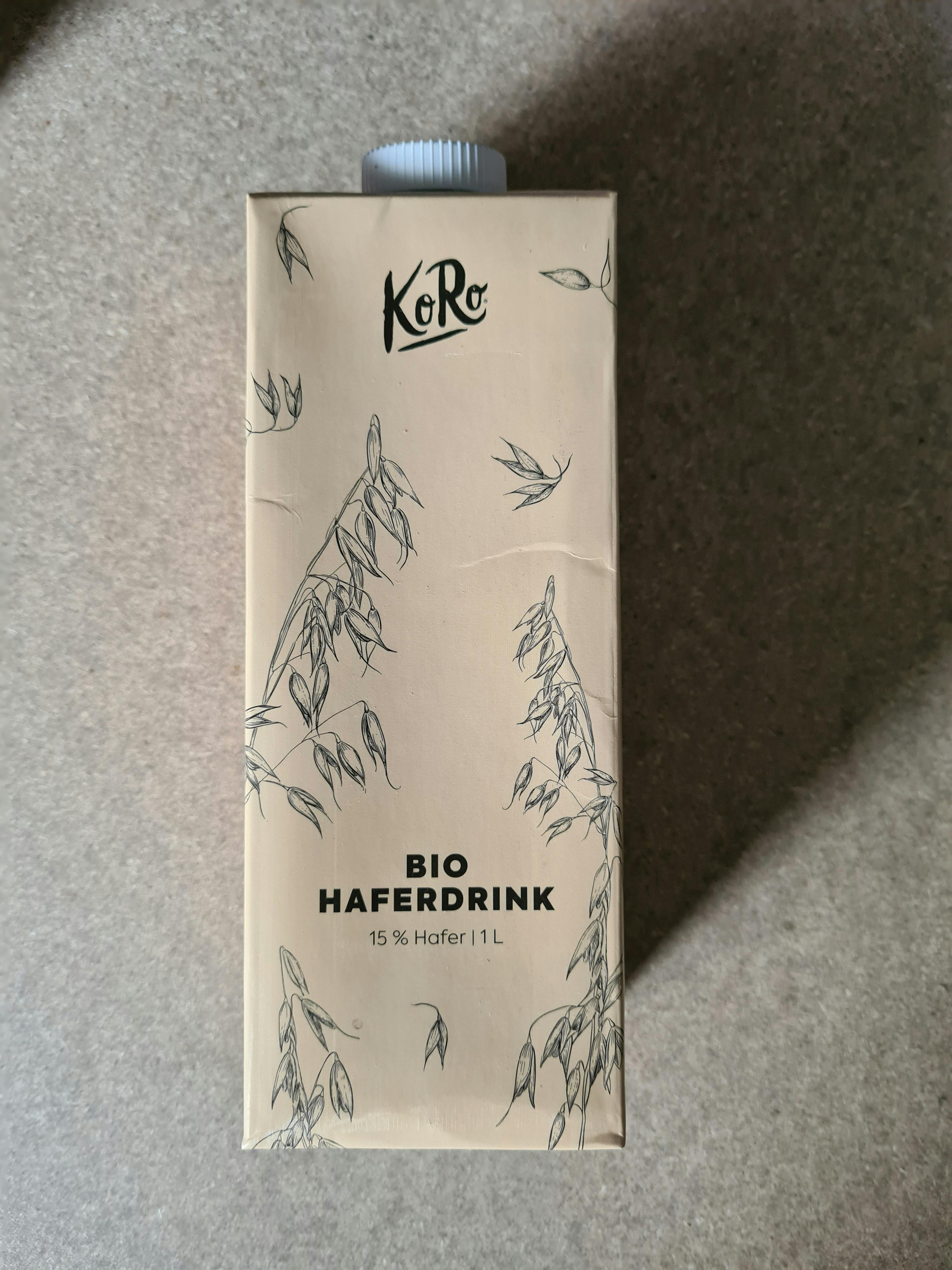 a carton of bio haferdrink sitting on a carpet