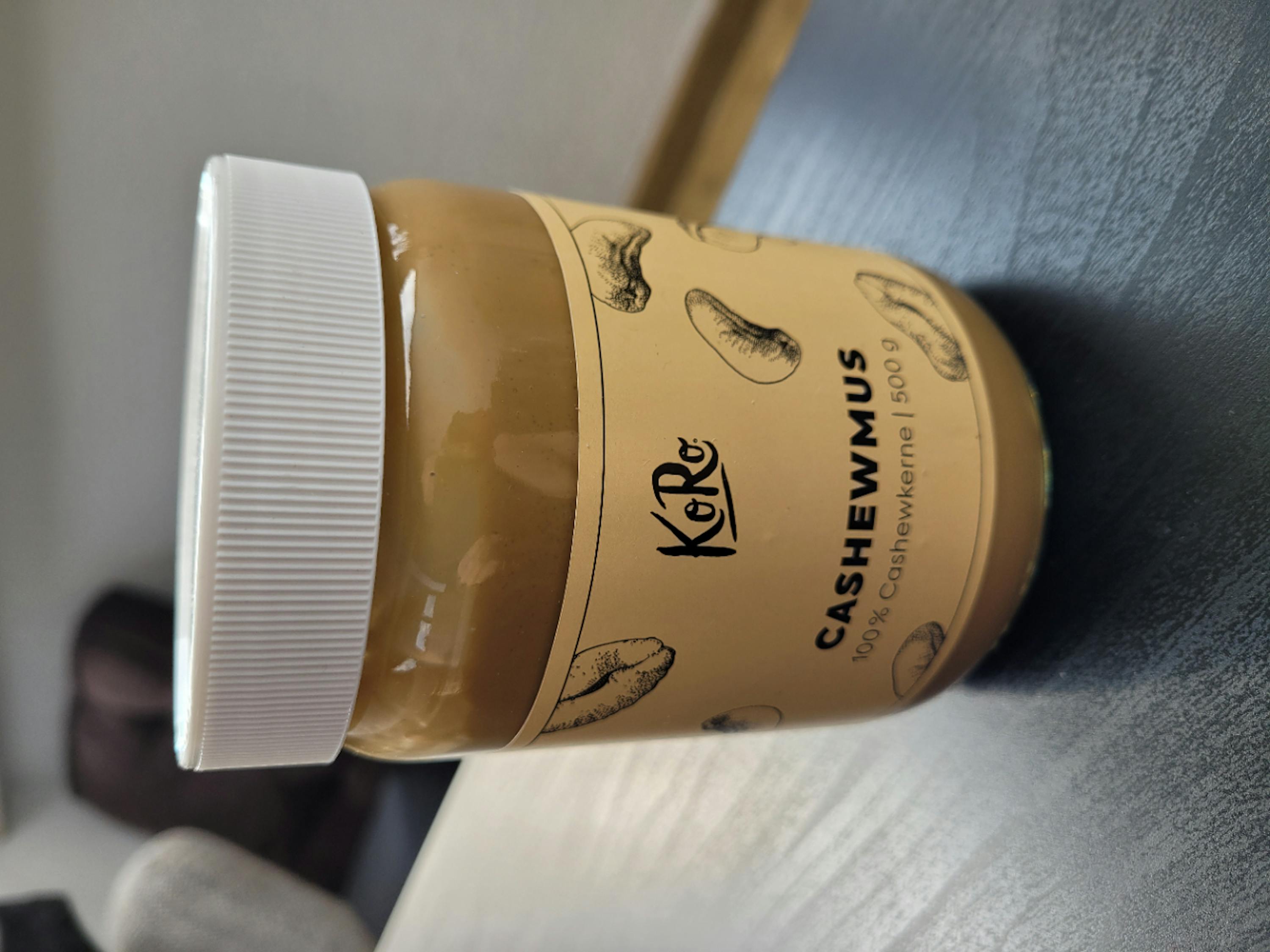 a jar of cashewmus is sitting on a table