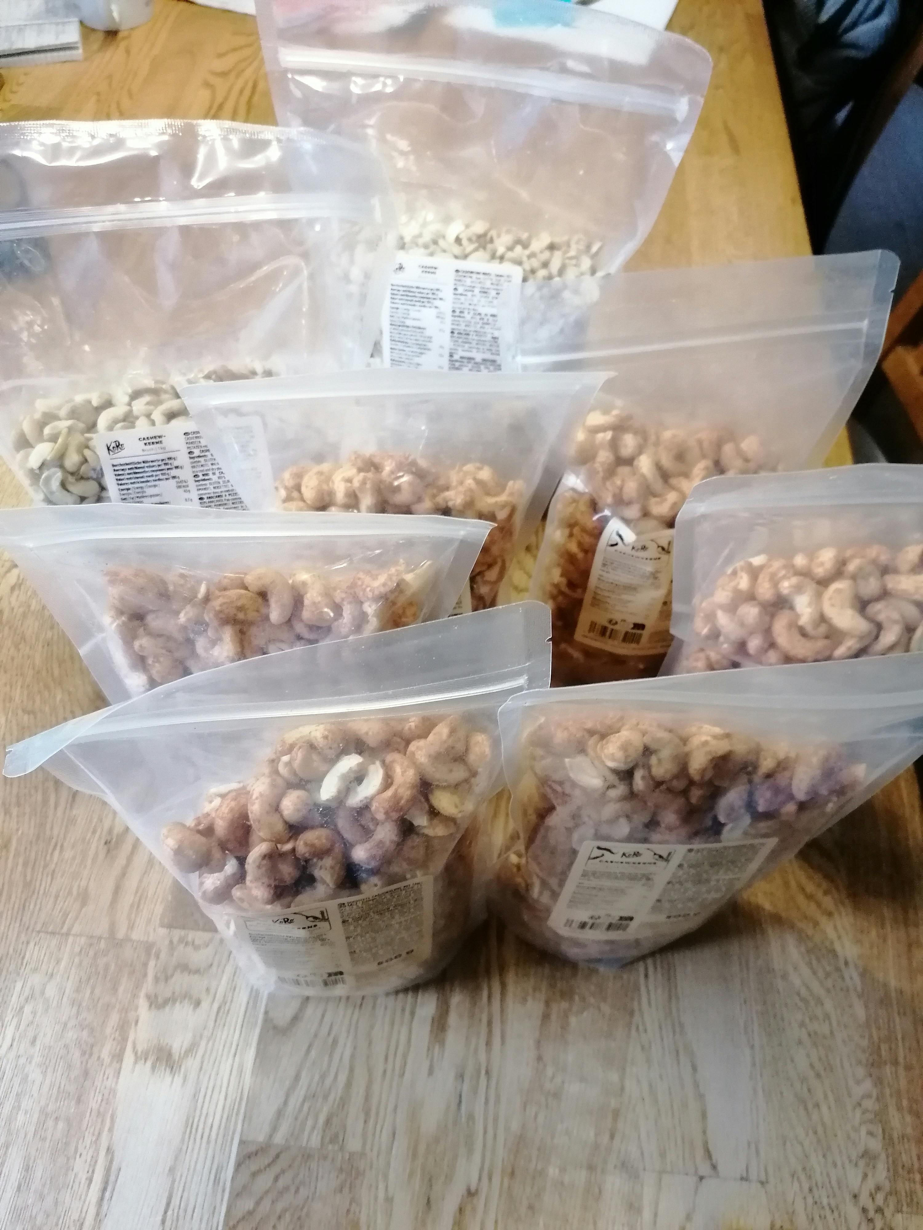 a bag of cashews sits on a wooden table